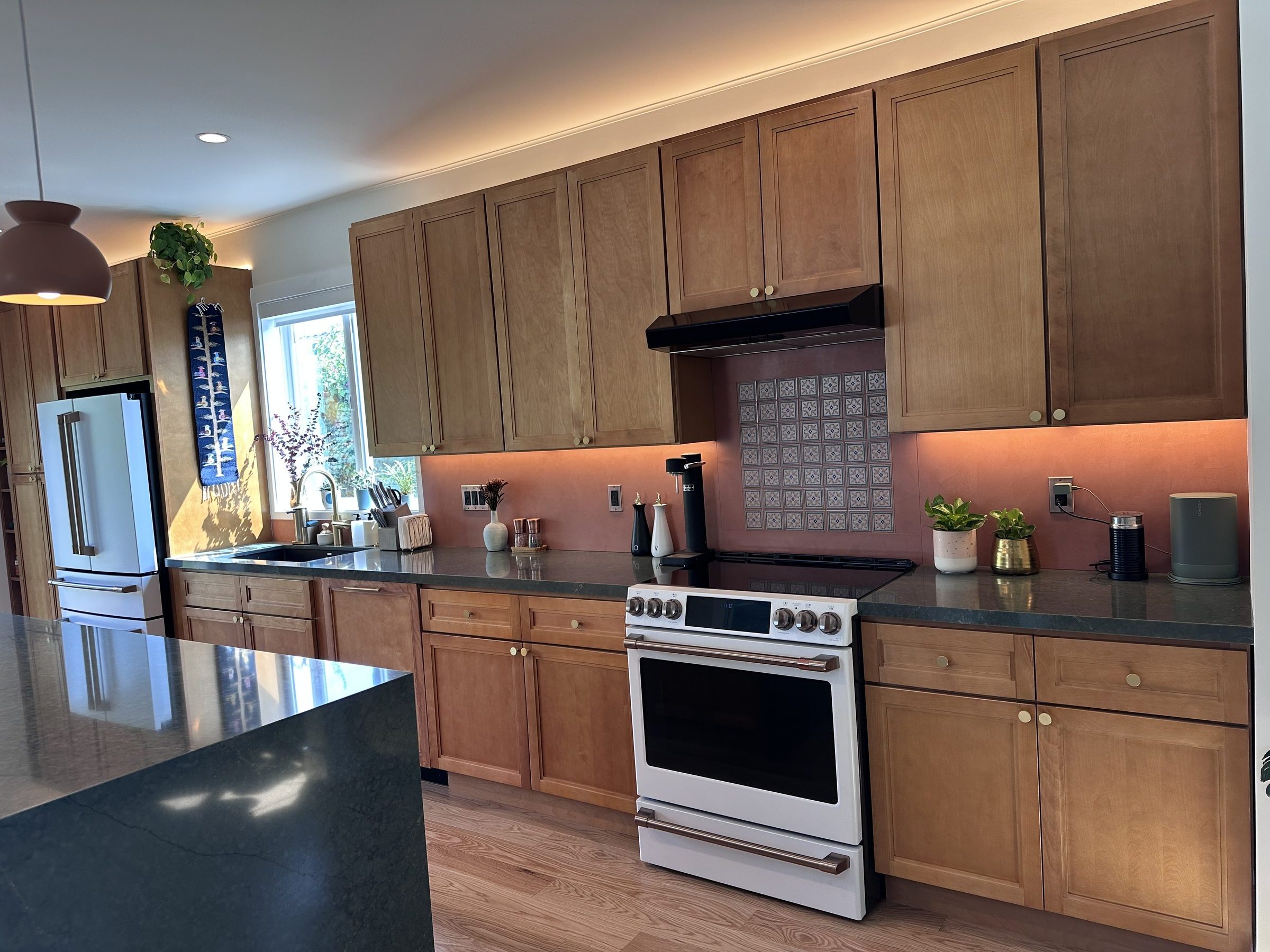 The new kitchen with all appliances and cabinets on one wall