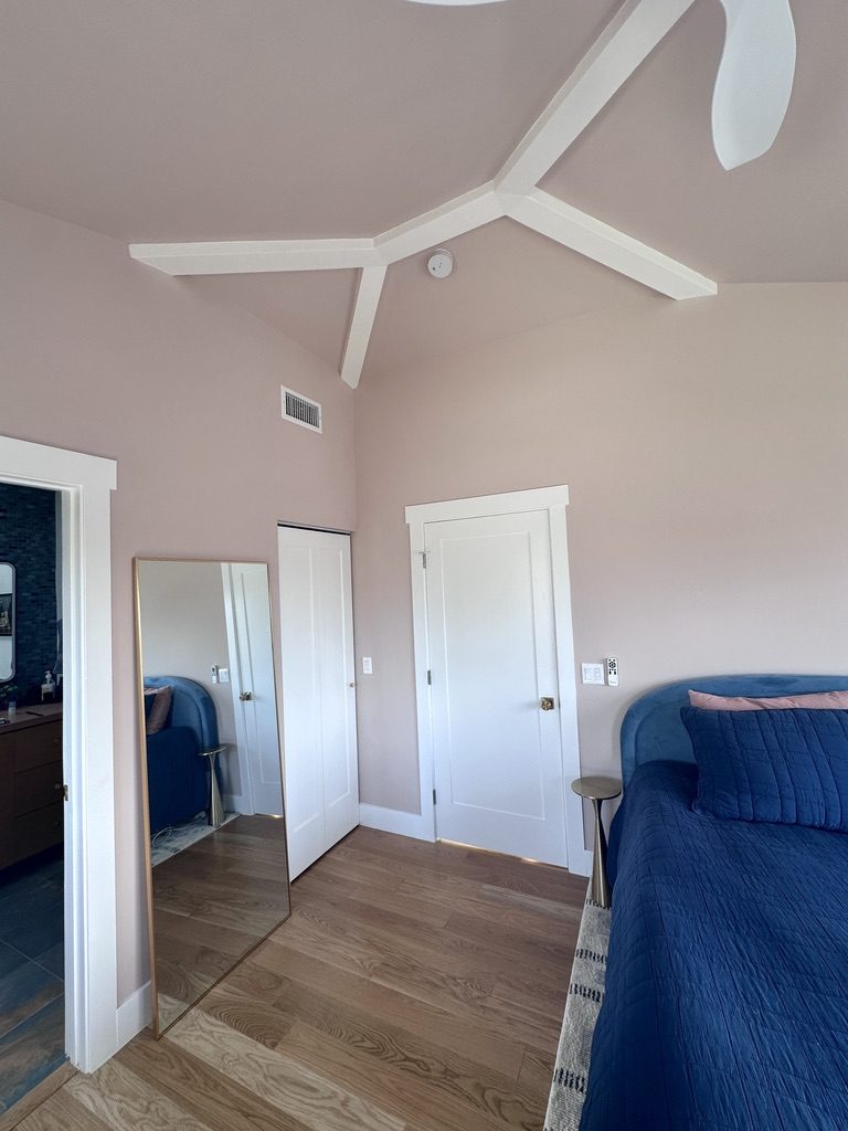 Off-center beam structure with closet doors and ensuite entry