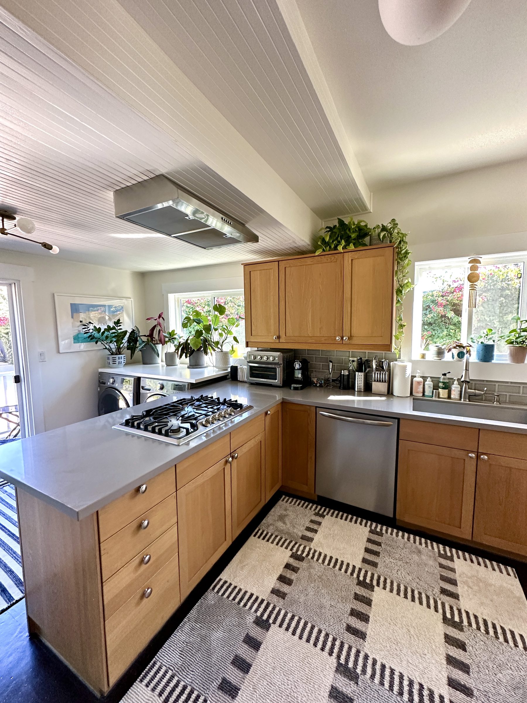Original galley kitchen with grey counters and dark floors