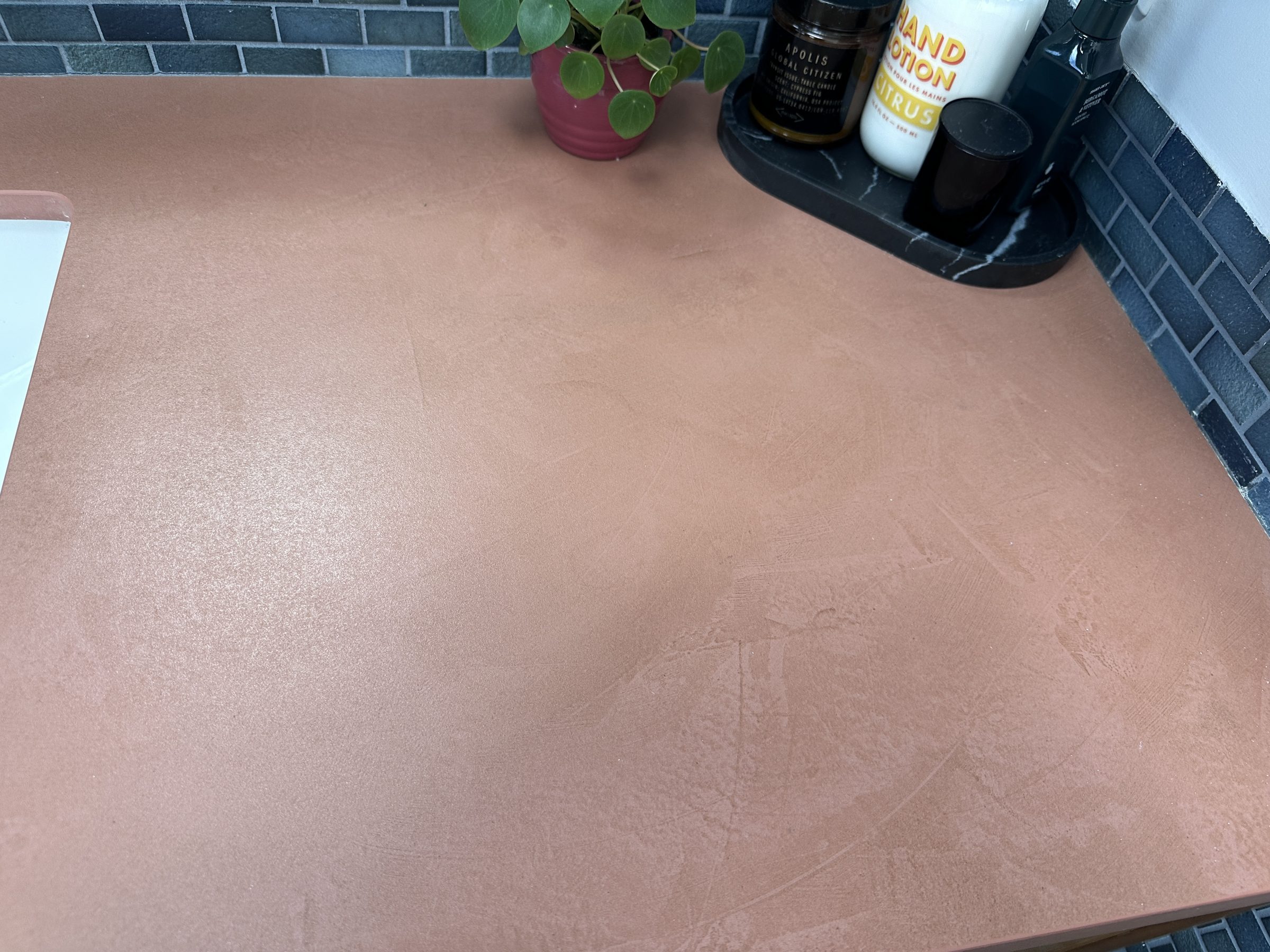 Terracotta Dekton countertop in bathroom